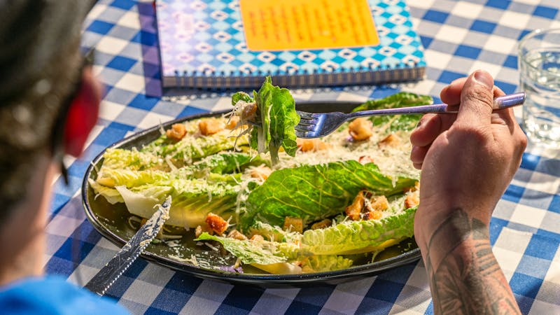 Caesar Salad with romaine lettuce, croutons, and Parmesan