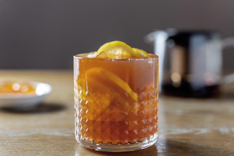 Iced tea in a glass with ice and lemon